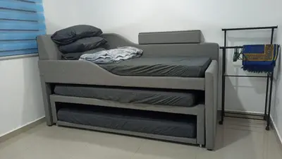 a stack of bunk beds in a room at TokBi Homestay Gerik in Gerik