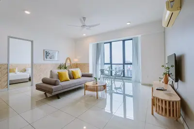 a living room with a couch and a table at The Jazz Serviced Suites in Tanjong Tokong