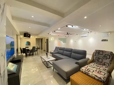 a living room with a couch and a table at Brand New Premium House & Karaoke @BM Near Iconcity in Bukit Mertajam