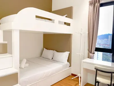 a white bunk bed in a room with a desk at Beacon Executive Suite with SkyPool 3BR 8pax Georgetown Penang in Georgetown