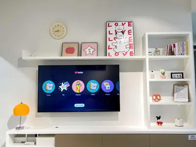 a flat screen tv on a white wall with shelves at Beacon Executive Suite with SkyPool 3BR 8pax Georgetown Penang in Georgetown
