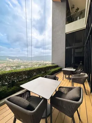 a patio with tables and chairs on a building at Beacon Executive Suite with SkyPool 3BR 8pax Georgetown Penang in Georgetown