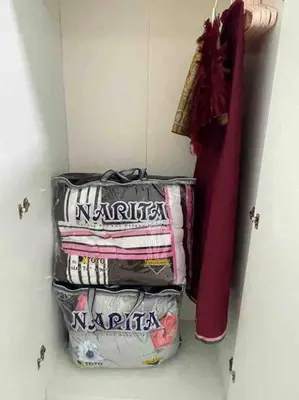 a pile of towels sitting in a closet at Hanna Homestay Apartment for Muslim in Tanah Rata