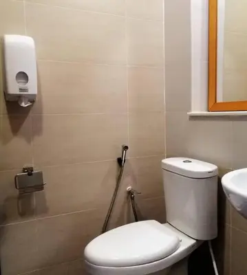 a bathroom with a toilet and a sink at Cameron Square, Nova Highlands - 1BR Studio Suite in Brinchang