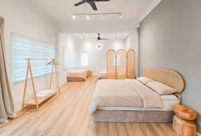 a bedroom with two beds and a ceiling fan at Spacious Corner Landed House Golden Hills Night Market in Brinchang