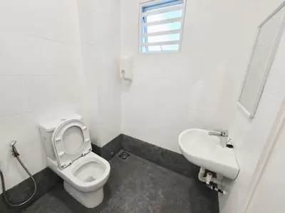 a bathroom with a toilet and a sink at Spacious Corner Landed House Golden Hills Night Market in Brinchang