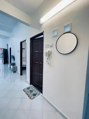 a mirror on a wall next to a door at Comfort Semi D House, 1 min to Town by Mr Homestay in Teluk Intan