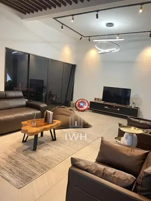 a living room with couches and a table and a tv at Ipoh 19A Villa for 12pax 6 Carpark with BBQ by IWH in Ipoh