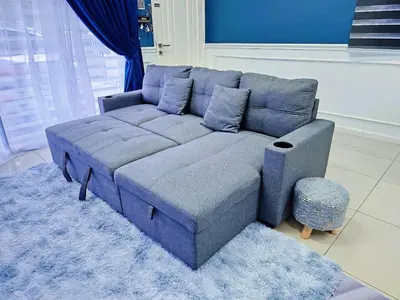 a blue couch sitting in a living room at Homestay By MSH Seri Iskandar in Seri Iskandar