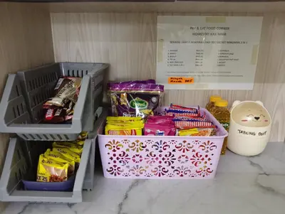 a refrigerator filled with different types of food and snacks at Homestay Kak Ninie in Teluk Intan