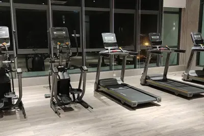 a gym with several exercise bikes in a room at H&W Sunway Onsen Suite Tambun Sunway City Ipoh in Ipoh