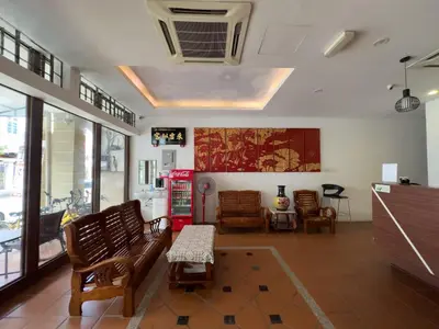 a living room with a couch and chairs and a table at Inn Residence 18 in George Town