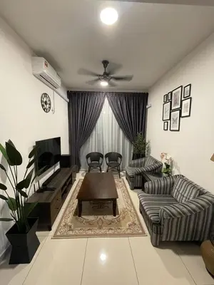 a living room with a couch and a coffee table at Meru Ipoh Residence Wifi+Pool (Muslim) in Bandar Meru Raya