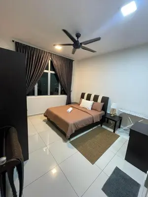 a bedroom with a bed and a ceiling fan at Meru Ipoh Residence Wifi+Pool (Muslim) in Bandar Meru Raya
