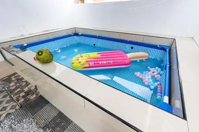 a toy pool with a hot dog on a shelf at Happy Gather Homestay \u6b22\u805a\u9601 in Ipoh