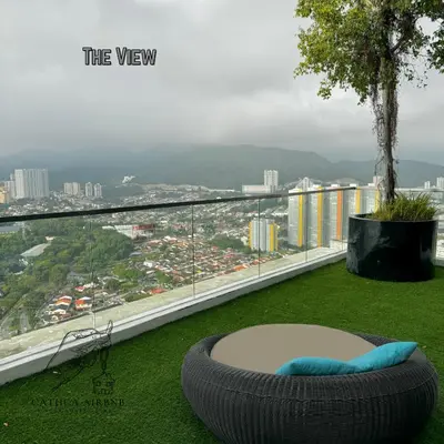 a large tire sitting on the grass on a balcony at Urban Suites 2BR #SelfCheck-in #6Pax #TopFacilities in Jelutong