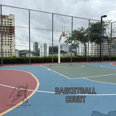 a tennis court with a basketball hoop on it at Urban Suites 2BR #SelfCheck-in #6Pax #TopFacilities in Jelutong