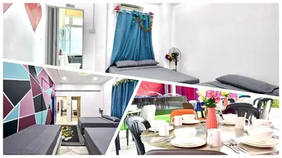 a room with a table and chairs and a bed at Penang Dream Banglo Events up to 120 Pax in Tanjung Bungah