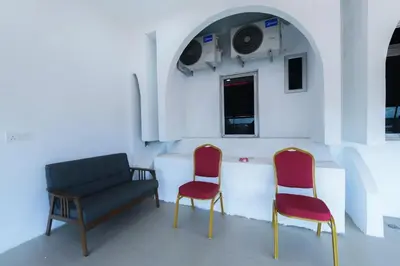 two chairs and a couch in a room at Capital O 90543 Sp Star Hotel in Sungai Petani