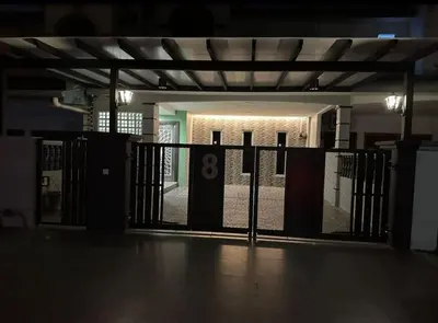 a gate in a parking lot with a number eight on it at (WI-FI) Ipoh Holiday Big House double storey DR8 in Ipoh