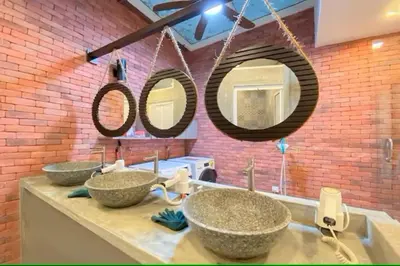 two sinks in a bathroom with two mirrors at Sogor Female Dormitory in George Town