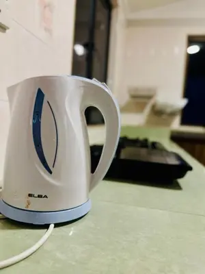 a white coffee cup sitting on top of a counter at (New) Beachside Antique Villa@14 pax in George Town