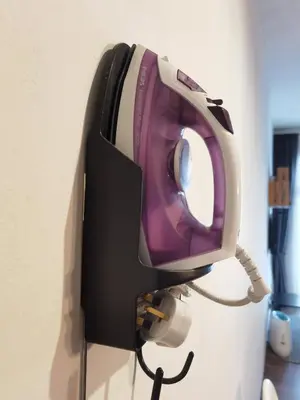 a fax machine hanging on a wall at G Residence - 2BR Family Suite Barrington Night Market - 3 in Brinchang