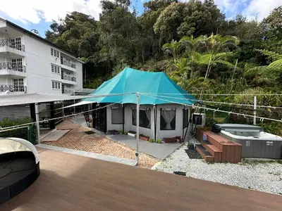 a blue tent sitting on top of a building at Safari Tent with Private Jacuzzi in Brinchang