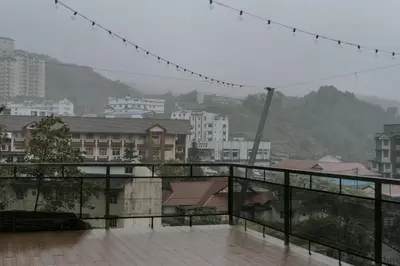 a balcony with a view of a city at Safari Tent with Private Jacuzzi in Brinchang