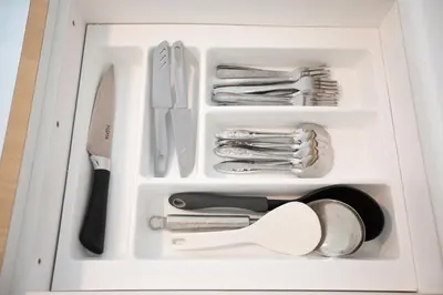 a drawer full of utensils in a white container at Muji Style 5BR Ferringhi Beach House 15Pax in Batu Ferringhi