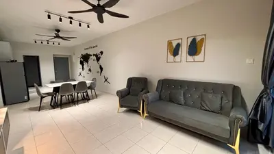 a living room with a couch and a table at Spacious HOUSE 4R 8pax WiFi-S Pic-Airport in Bayan Lepas