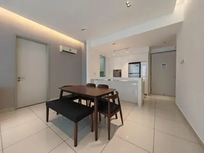a kitchen and dining room with a wooden table and chairs at Harmony Haven with Bathtub - Jazz Suites by Ocean Luxe in Tanjong Tokong