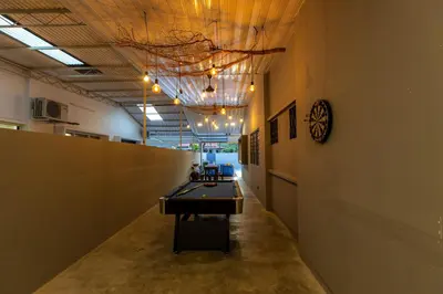 a hallway with a ping pong table in a room at 5R4B 15Pax V KTV,KID'S POOL,POOL TABLE NEAR USM,LWE HOSPITAL,SPI ARENA in George Town