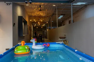 a swimming pool with two toys in the water at 5R4B 15Pax V KTV,KID'S POOL,POOL TABLE NEAR USM,LWE HOSPITAL,SPI ARENA in George Town