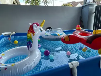 a childs pool with an inflatablevisorangering at -NEW- 22Pax 5R4B V KTV,KID'S POOL,POOL TABLE NEAR USM,LWE HOSPITAL,SPI ARENA in George Town