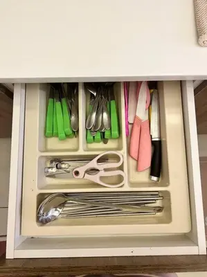 a drawer filled with utensils in a cabinet at Lily Fair ~ Cameron Highlands in Tanah Rata