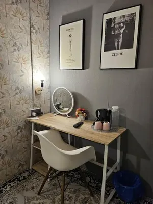 a room with a desk with a chair and a mirror at Le Melur in George Town