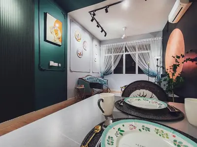 a dining room with a table with plates on it at Moon Classic Falim by Irainbow in Ipoh