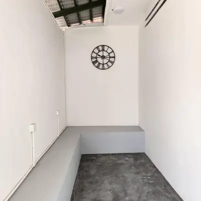 a white room with a clock on the wall at ipoh town centre - nordic 7pax in Ipoh