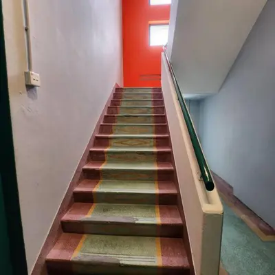 a staircase in a building with a colorful carpet at Ipoh town centre -rustic home 4pax (studio 5) in Ipoh