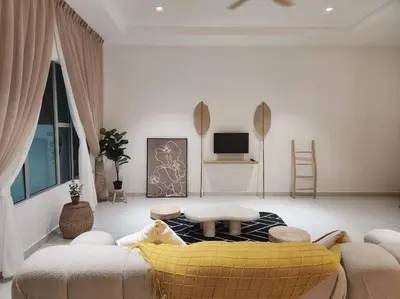 a living room with a couch and a table at Botani Ipoh wabi sabi inshome 18 in Ipoh