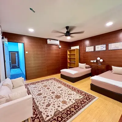 a living room with two beds and a couch at Pertak Malai @ Kuala Kubu Bharu in Kuala Kubu Baharu