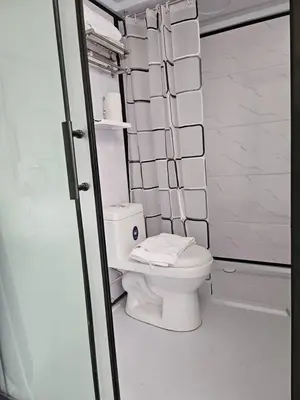 a bathroom with a white toilet in a room at le melur guest house in George Town
