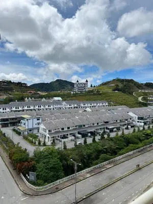 a large building with a road in front of it at Alliv NSF Studio & 1 Bedroom Apartment Stay in Brinchang