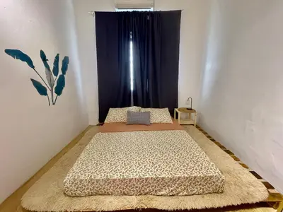two beds in a room with a window at Home11A#4pax#Netflix#AlmaBukitMertajam in Bukit Mertajam