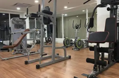 a gym with several exercise equipment in a room at Champs Elysees Homestay by Landmark @ Kampar in Kampar