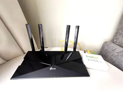 a black stand with two monitors on top of a desk at The Horizon Ipoh 2BR L12 by Grab A Stay in Ipoh
