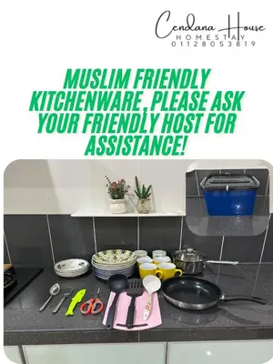 a kitchen counter with a stove top with a sign at Cendana House Juru Autocity Bkt Minyak Batu Kawan IKEA in Simpang Ampat
