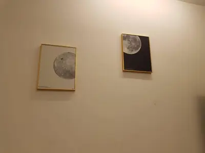 two pictures of the moon hanging on a wall at BLUE DOME (Space) @ Night Market, Cameron. 2R2B in Brinchang