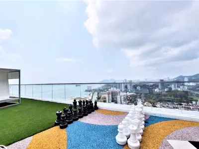 a group of people sitting on the roof of a building at Infinity Pool, Georgetown, Up to 11 Pax, 2 Bedrooms, 2 Bathrooms, 2 Car Parks by Star Home in Jelutong